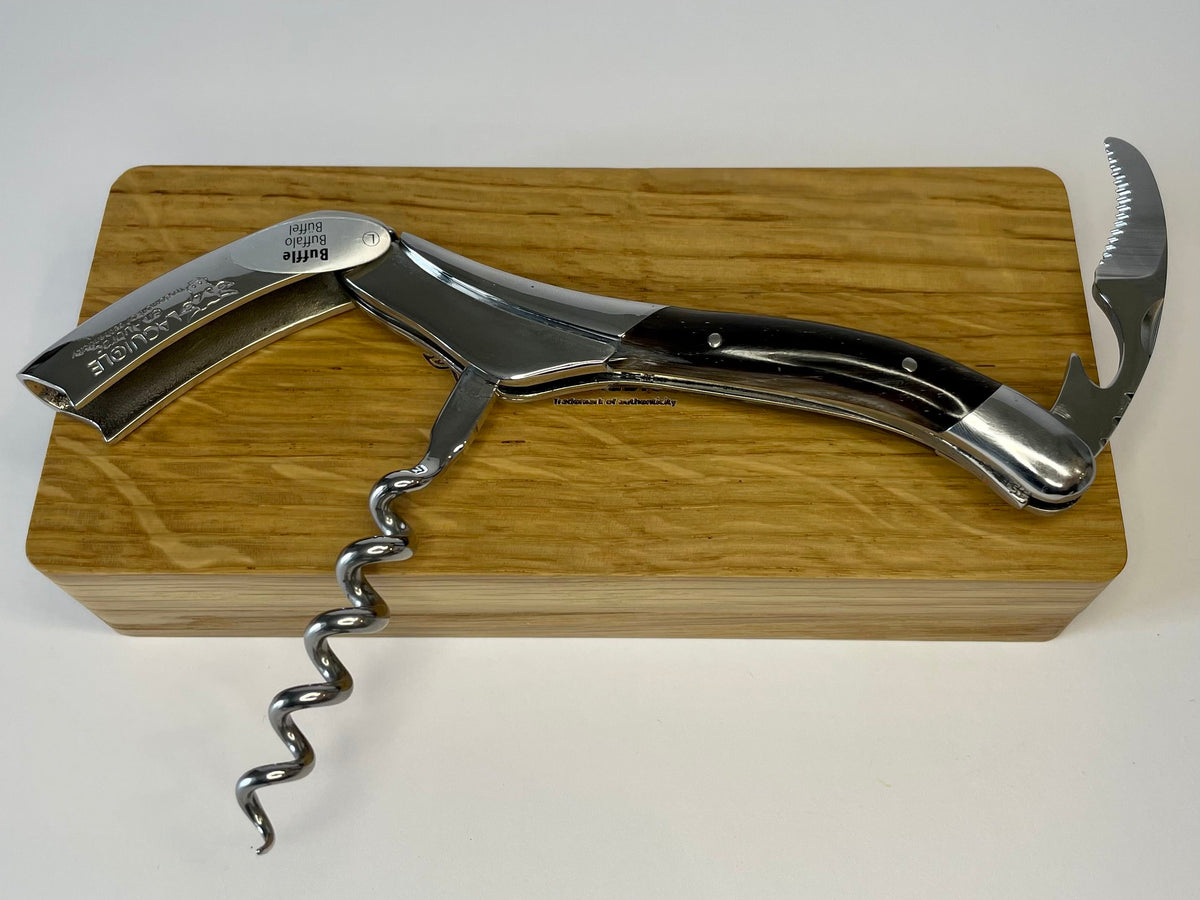 Corkscrew opened on the oak box with the spiral and lever extended