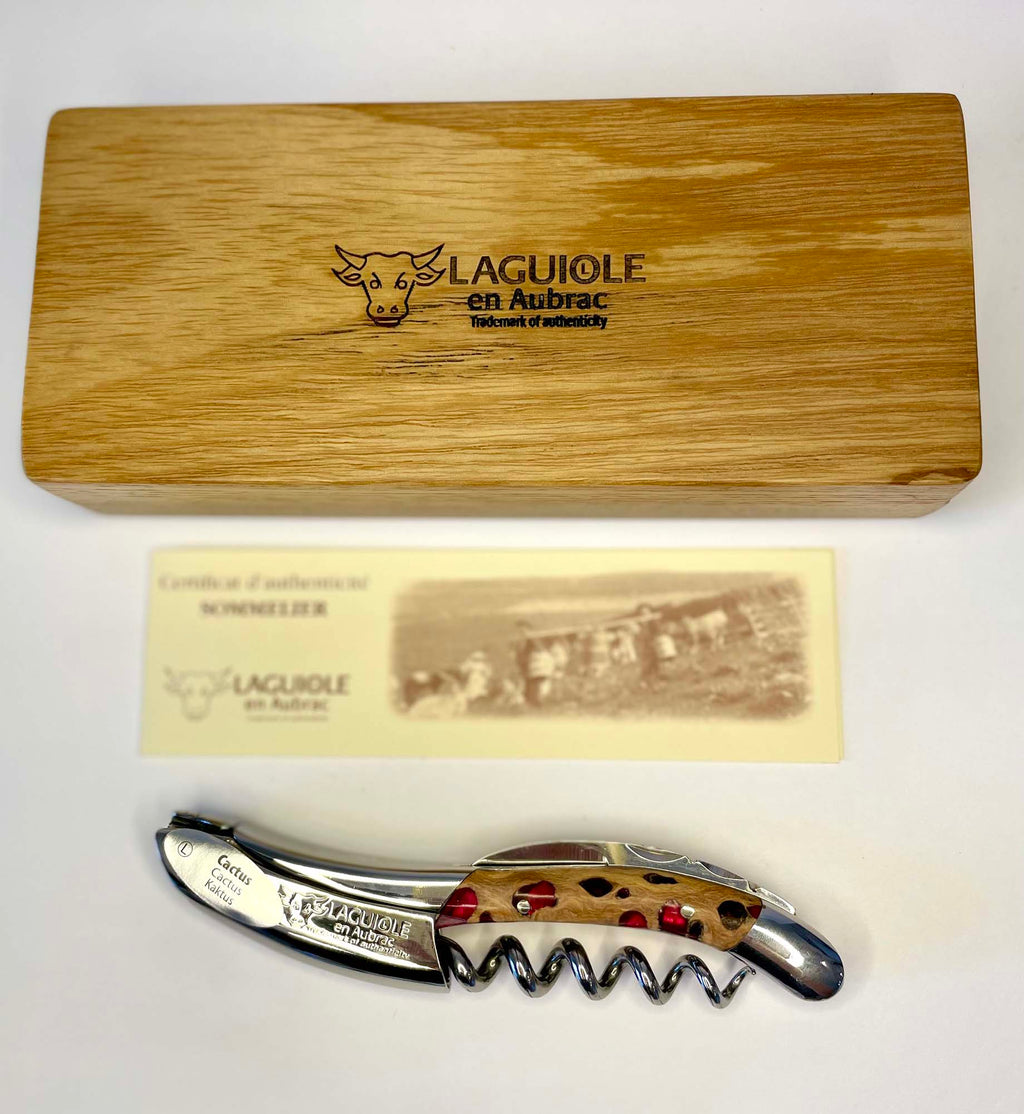 Oak gift box and certificate of authenticity above the fuchsia corkscrew