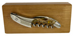 Corkscrew resting on the closed oak gift box