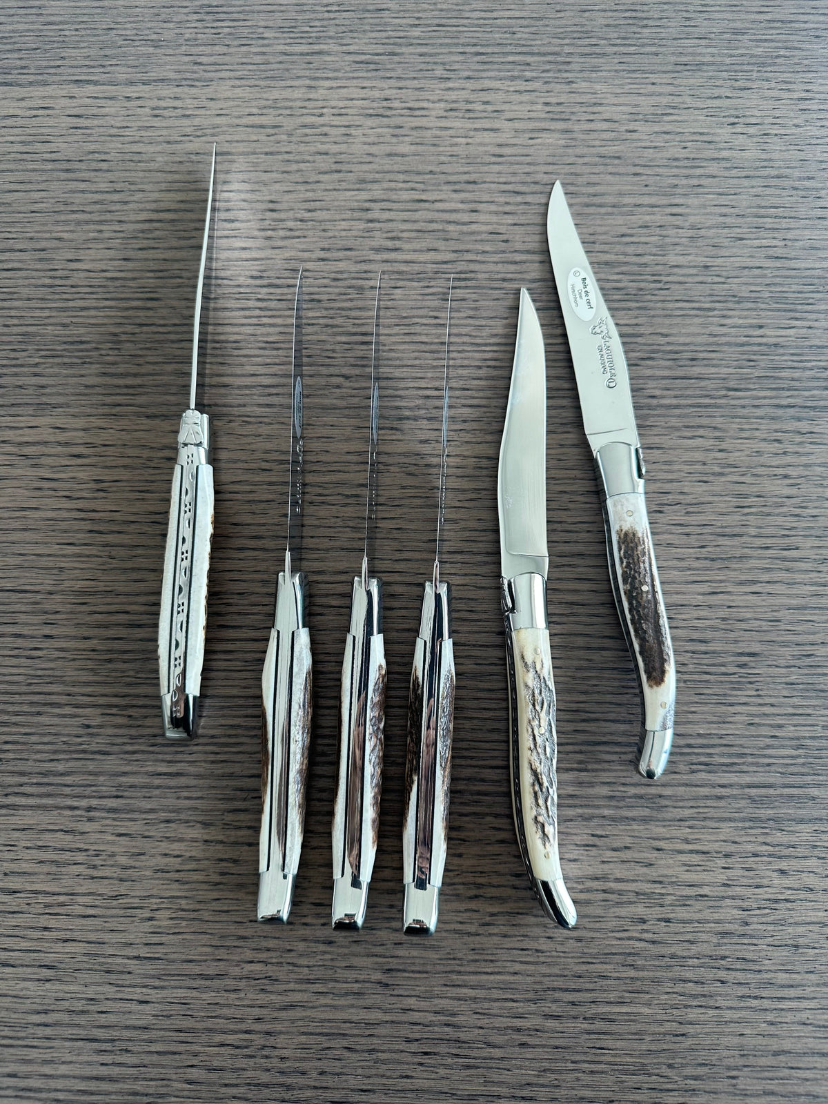 Knives standing at different angles with two blades turned out