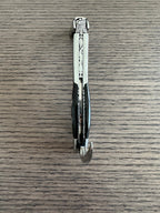 Folded corkscrew seen from above showing the carved spine