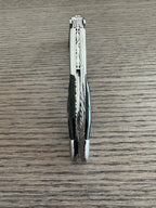 Close view of the worked steel spine on the folded corkscrew