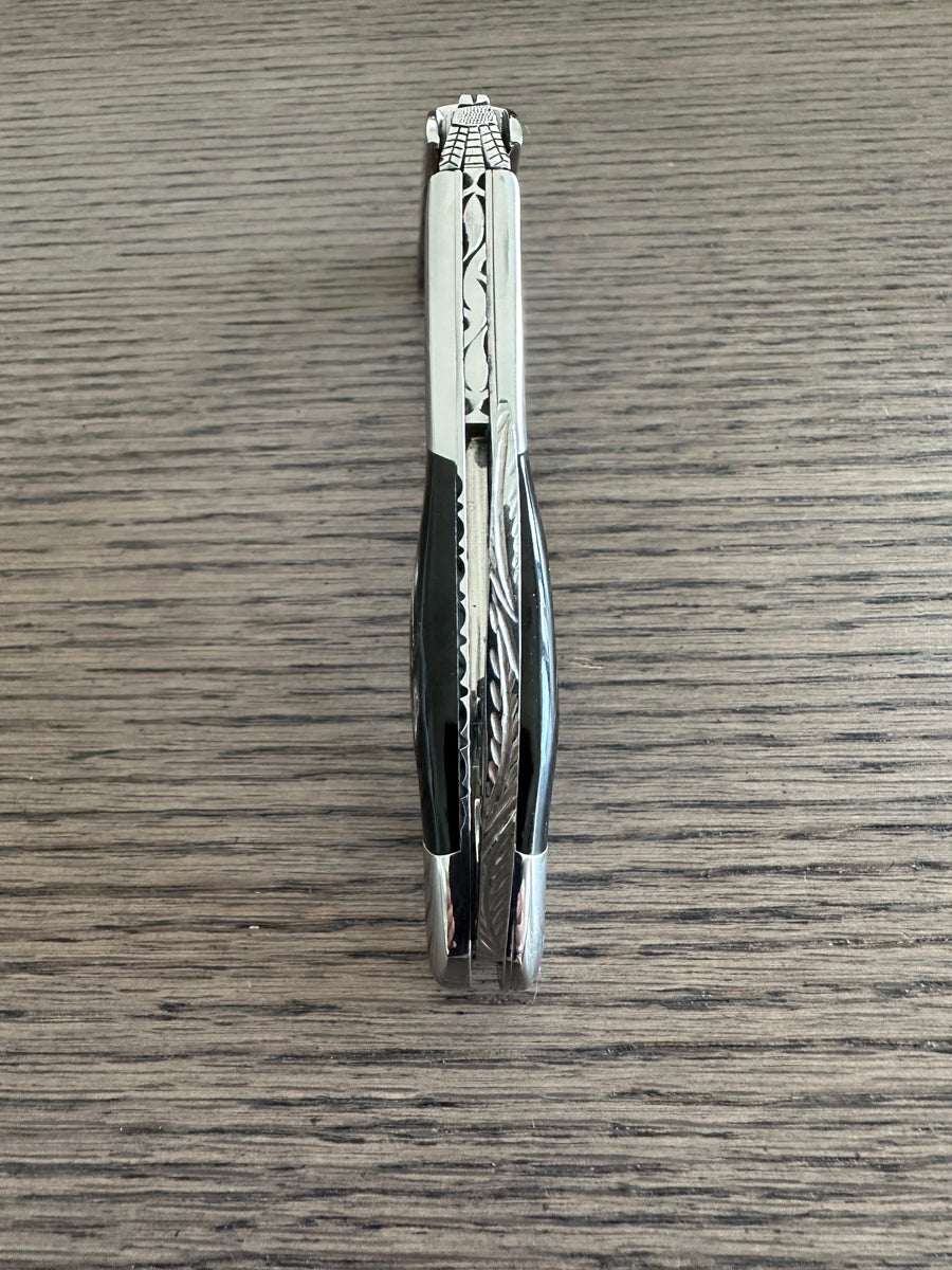 Close view of the worked steel spine on the folded corkscrew
