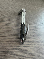Folded corkscrew with the foil cutter slightly open