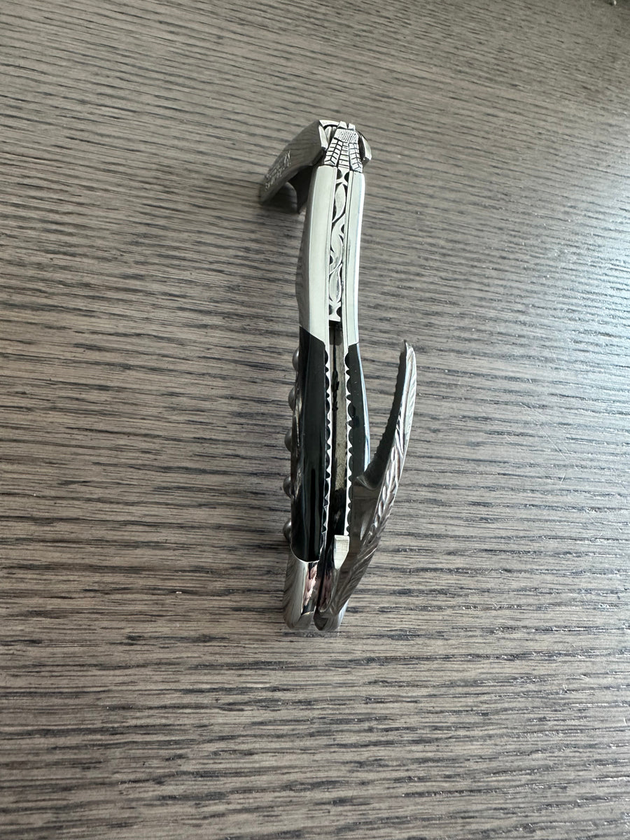 Folded corkscrew with the foil cutter slightly open