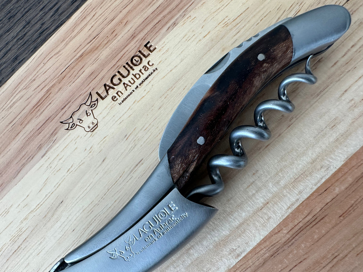 Detail of the spiral and grapevine wood handle on the oak box