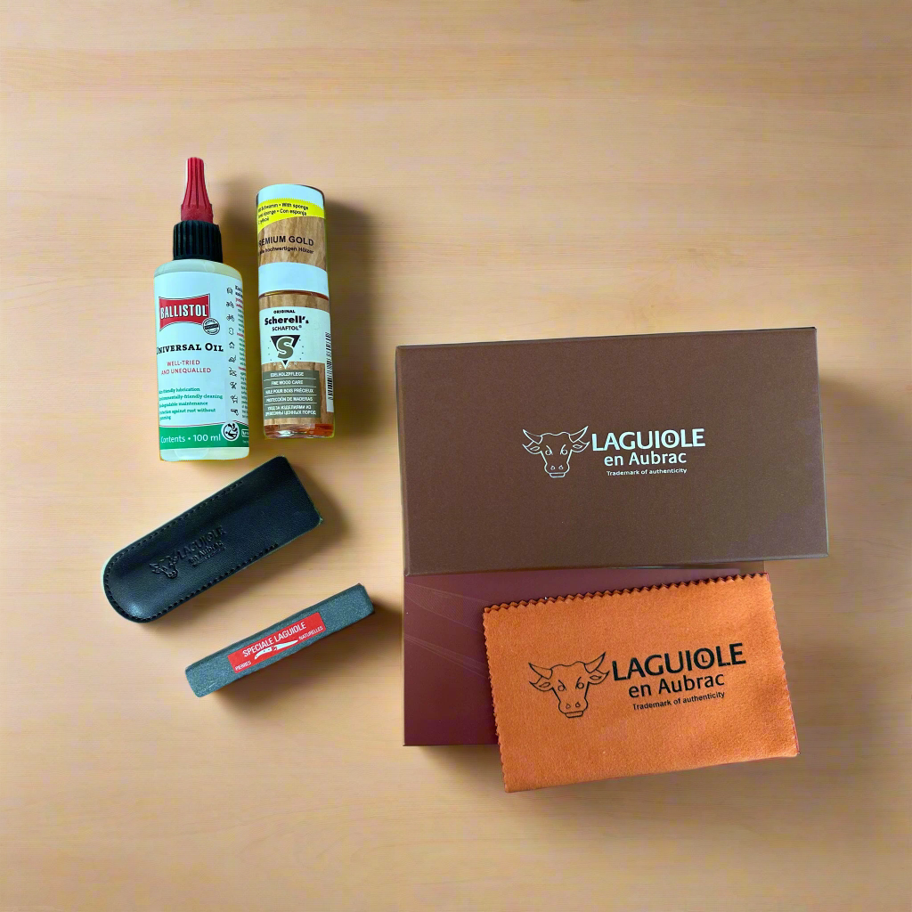 Oil, wood care, stone case and cloth arranged beside the box on a warm surface