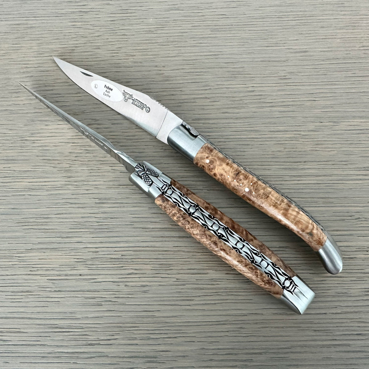 Two views of the ash burl knife side by side
