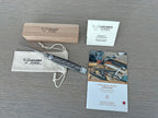 Knife with its wooden box, cotton pouch, certificate and booklet