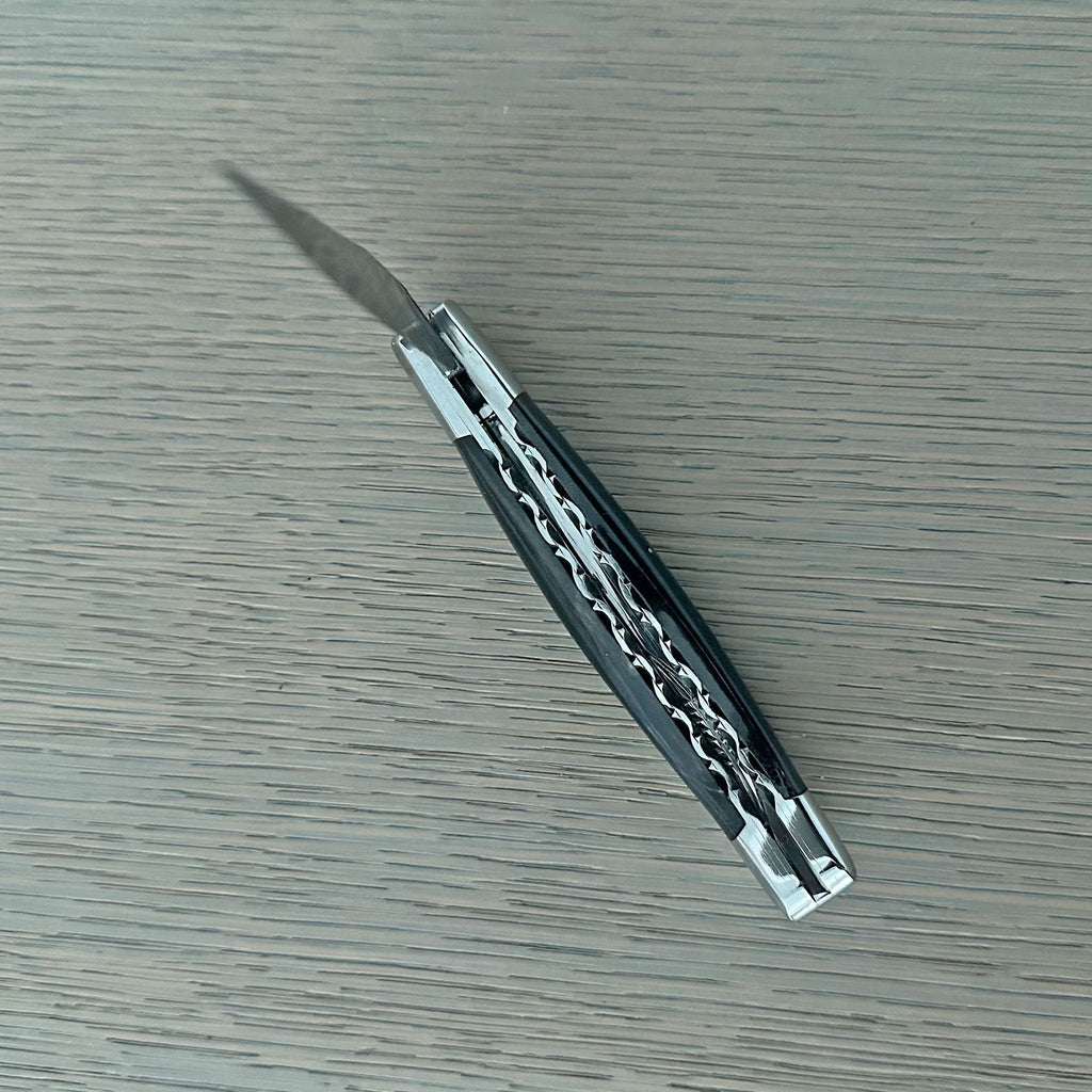 Closed knife at an angle showing the worked back
