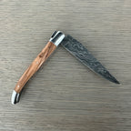 Half open knife from the other side with the blade pointing right