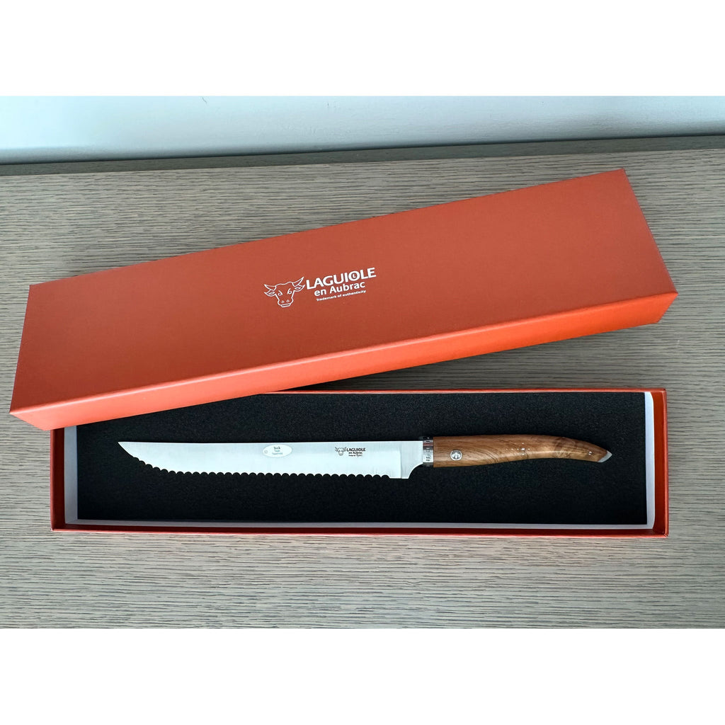 Teak bread knife in an open orange Laguiole en Aubrac gift box