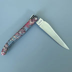Knife half open with the blade pointing right