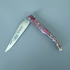 Knife half open with the blade pointing left