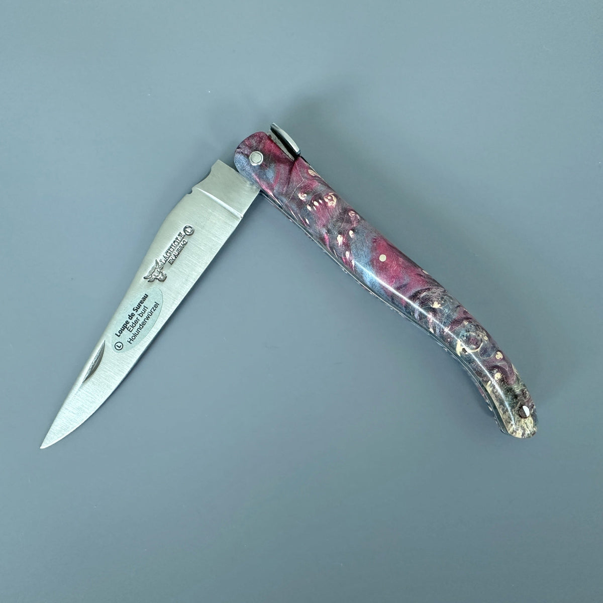 Knife half open with the blade pointing left