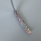 Open knife from the back with the spring facing up