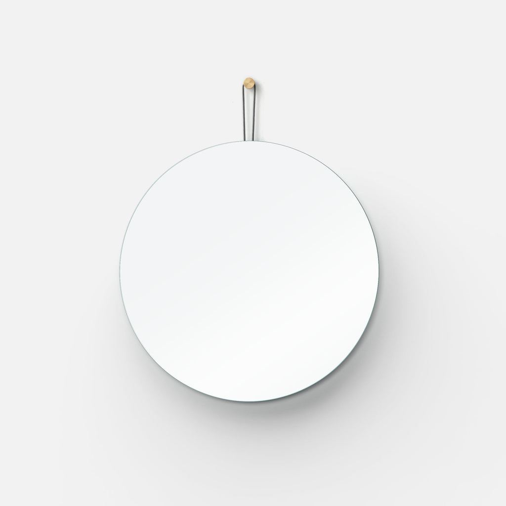 Lure Round mirror in a hallway
