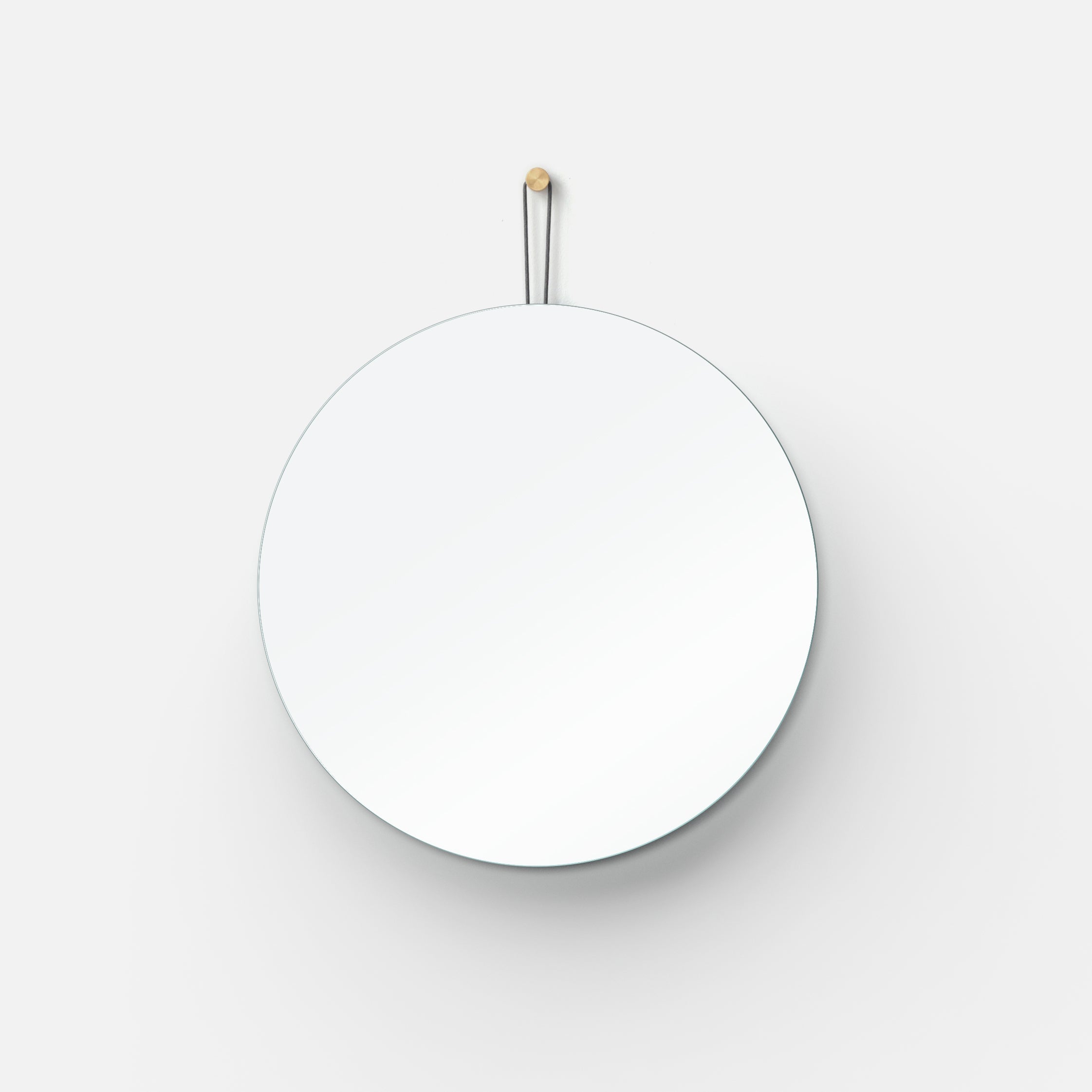 Lure Round mirror in a hallway
