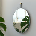 round wall mirror in a powder room