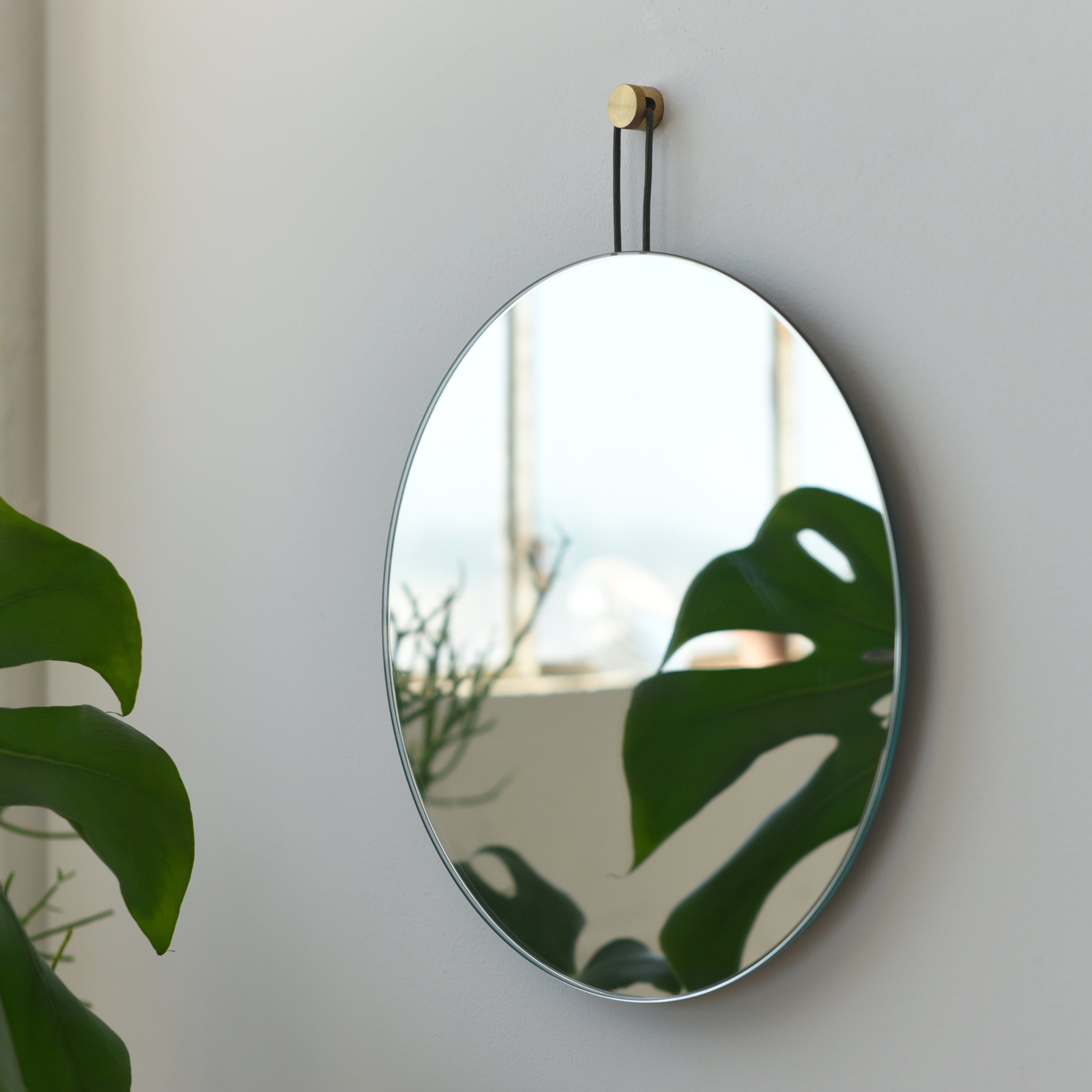 round wall mirror in a powder room