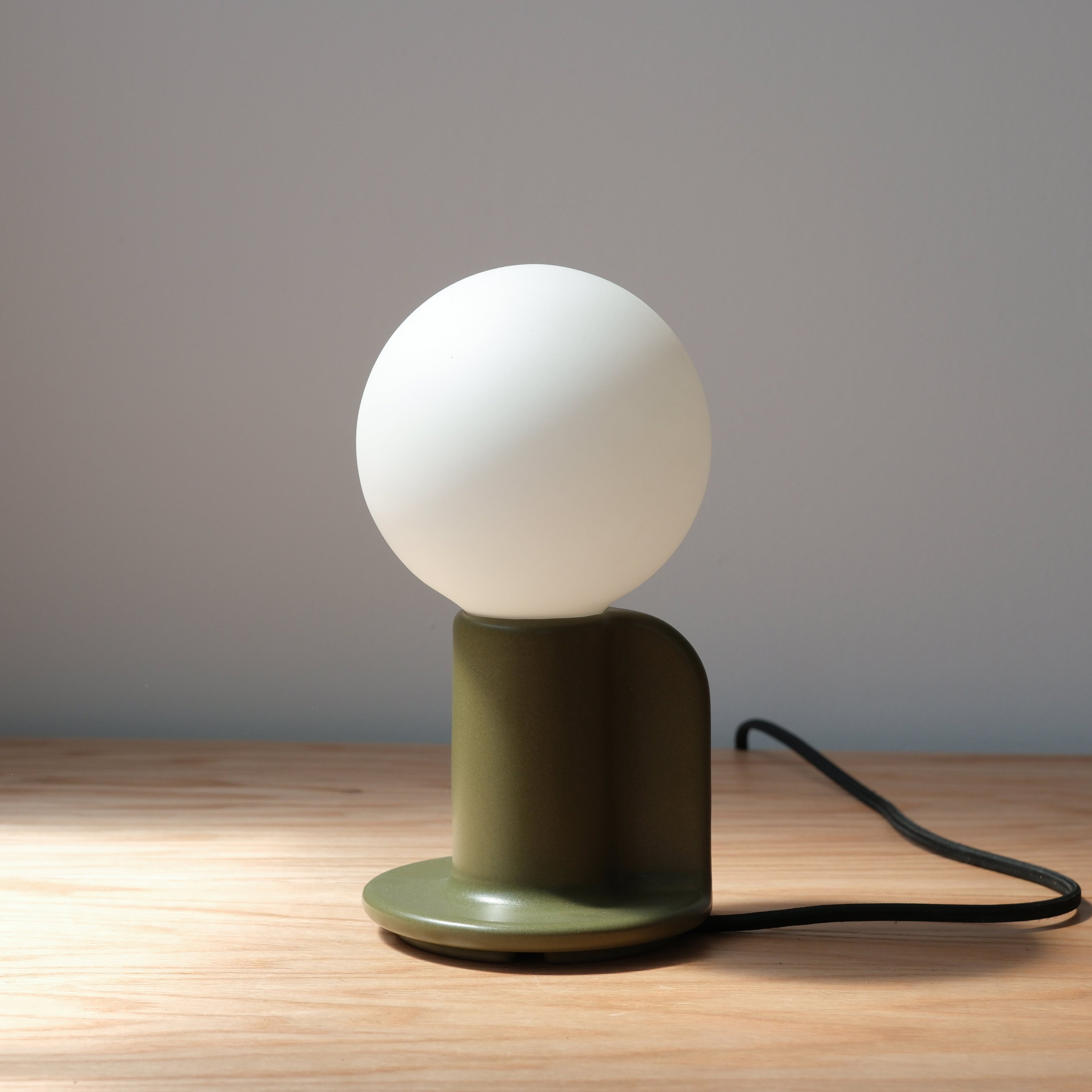 Q Table Lamp lit, warm 2700K glow