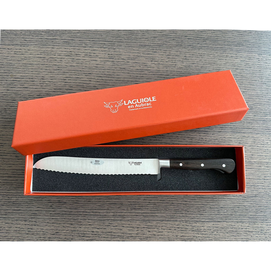 Ebony bread knife in an open orange Laguiole en Aubrac gift box