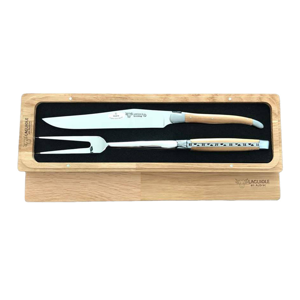 Carving knife and fork side by side in the open box, lid beneath