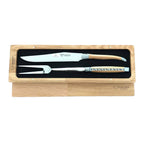 Carving knife and fork side by side in the open box, lid beneath