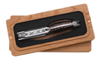 Corkscrew in its box turned to show the carved spine