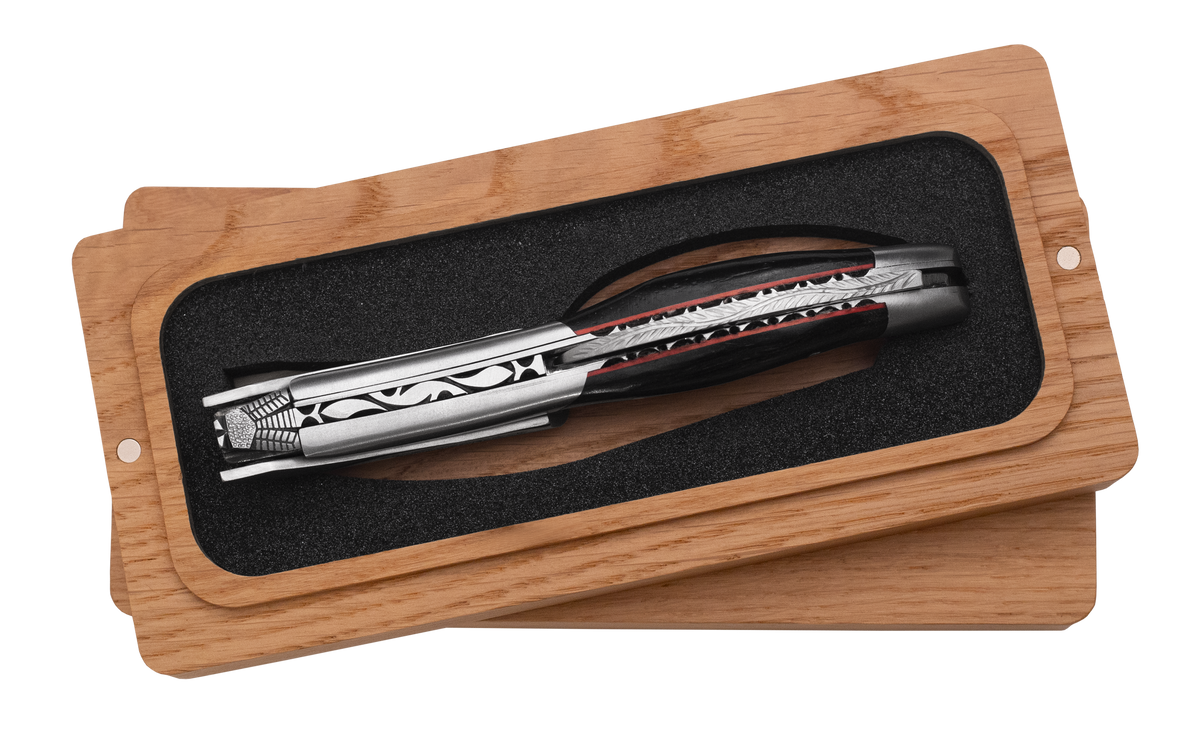 Corkscrew in its box turned to show the carved spine