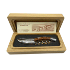 Amourette corkscrew in an open oak box with the certificate of authenticity