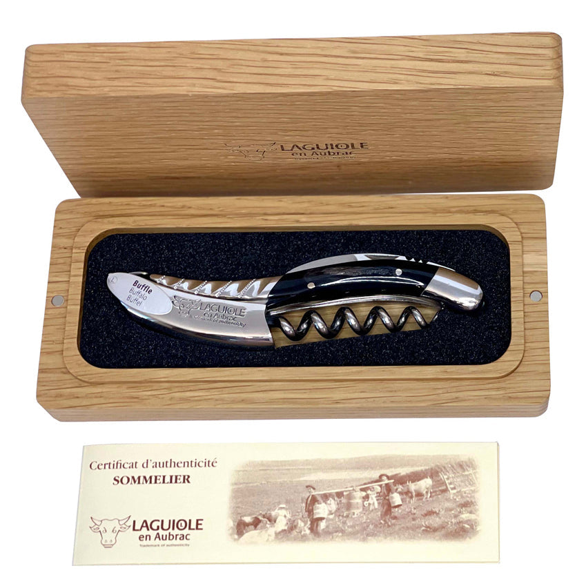 Boxed buffalo horn corkscrew above the certificate of authenticity