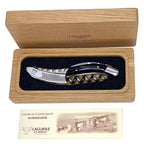 Boxed buffalo horn corkscrew above the certificate of authenticity