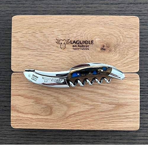 Blue cactus handled corkscrew laid on an engraved oak gift box