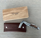 Oak box with the corkscrew resting on its brown leather pouch