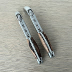 Two views of the folded corkscrew side by side on a grey surface