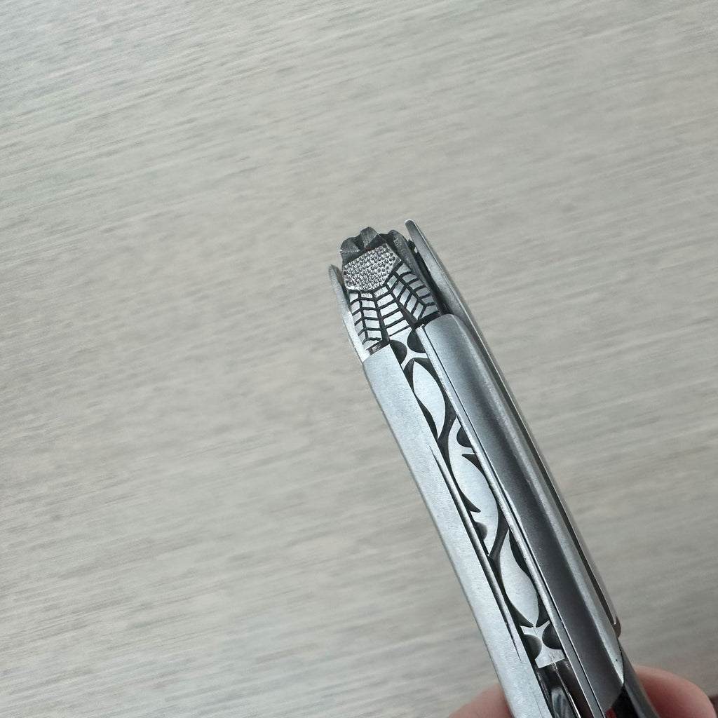 Close view of the carved steel pattern along the top