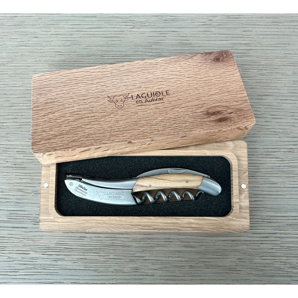 Laguiole numbered olive wood corkscrew with black inlay in its open oak box