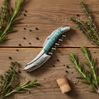Corkscrew on a rustic table with rosemary sprigs, peppercorns and a cork