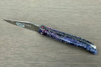 Open knife with the matte blade pointing left