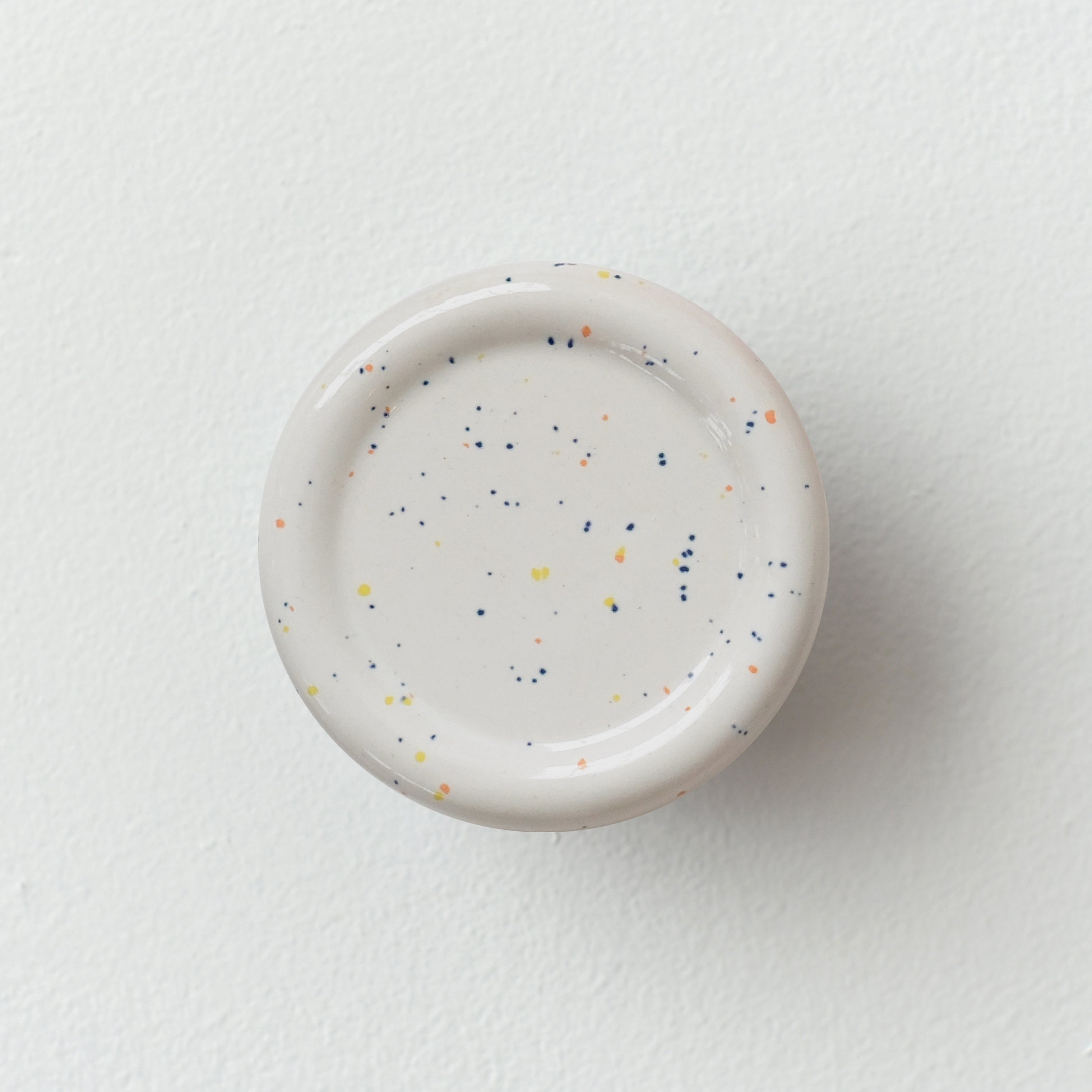 handmade ceramic coat hook in a hallway