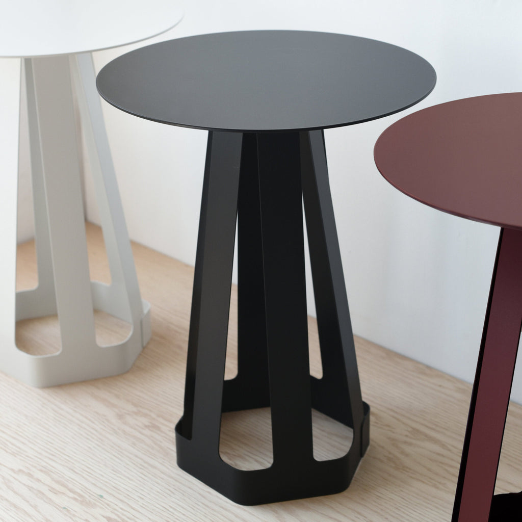 compact side table beside a reading chair