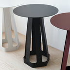 compact side table beside a reading chair