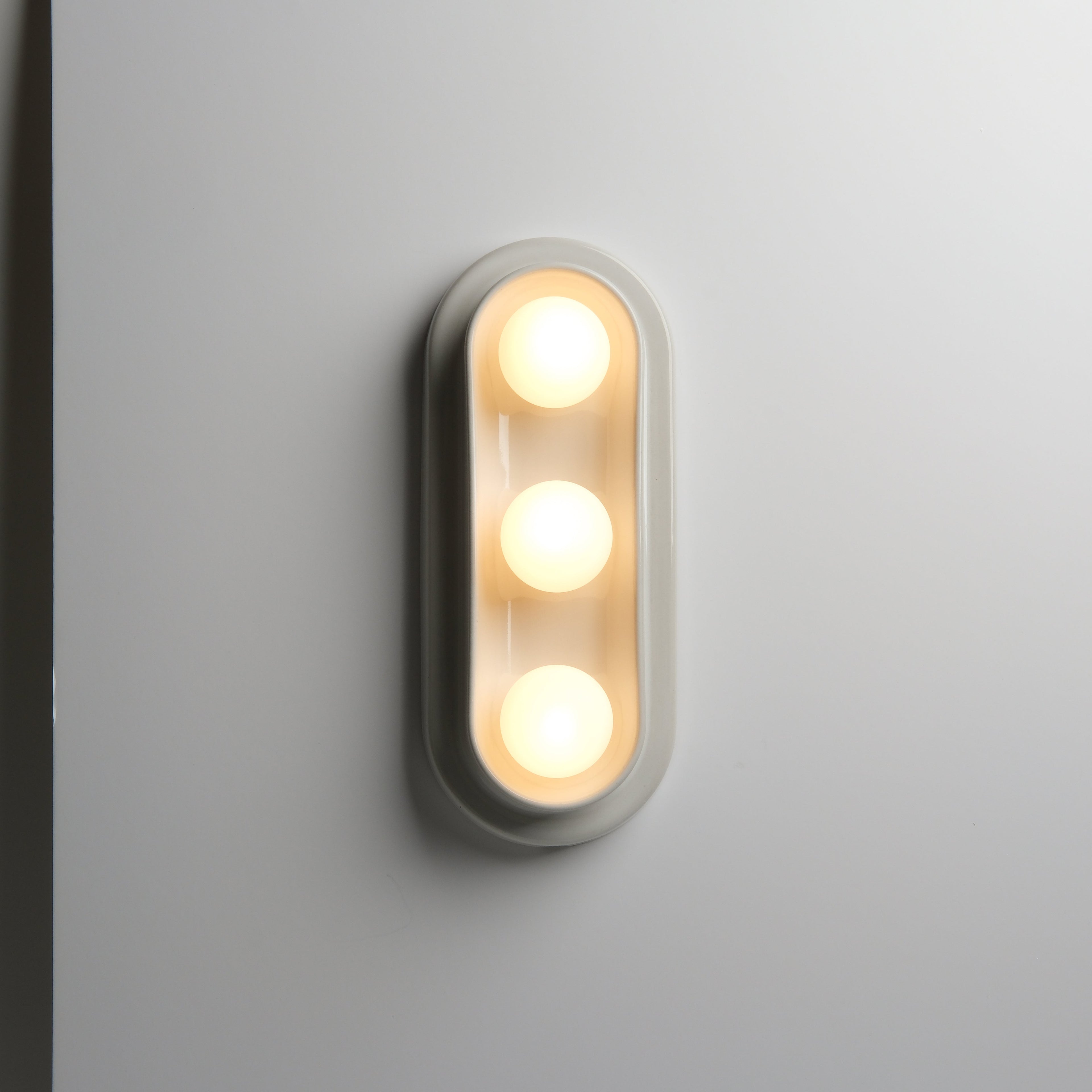 Q Triple Sconce dimmed to bedtime glow