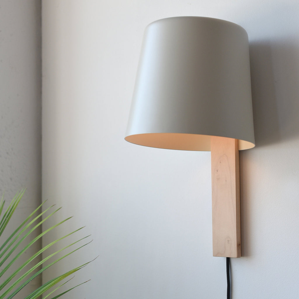 Pilot Sconce mounted beside an entryway mirror