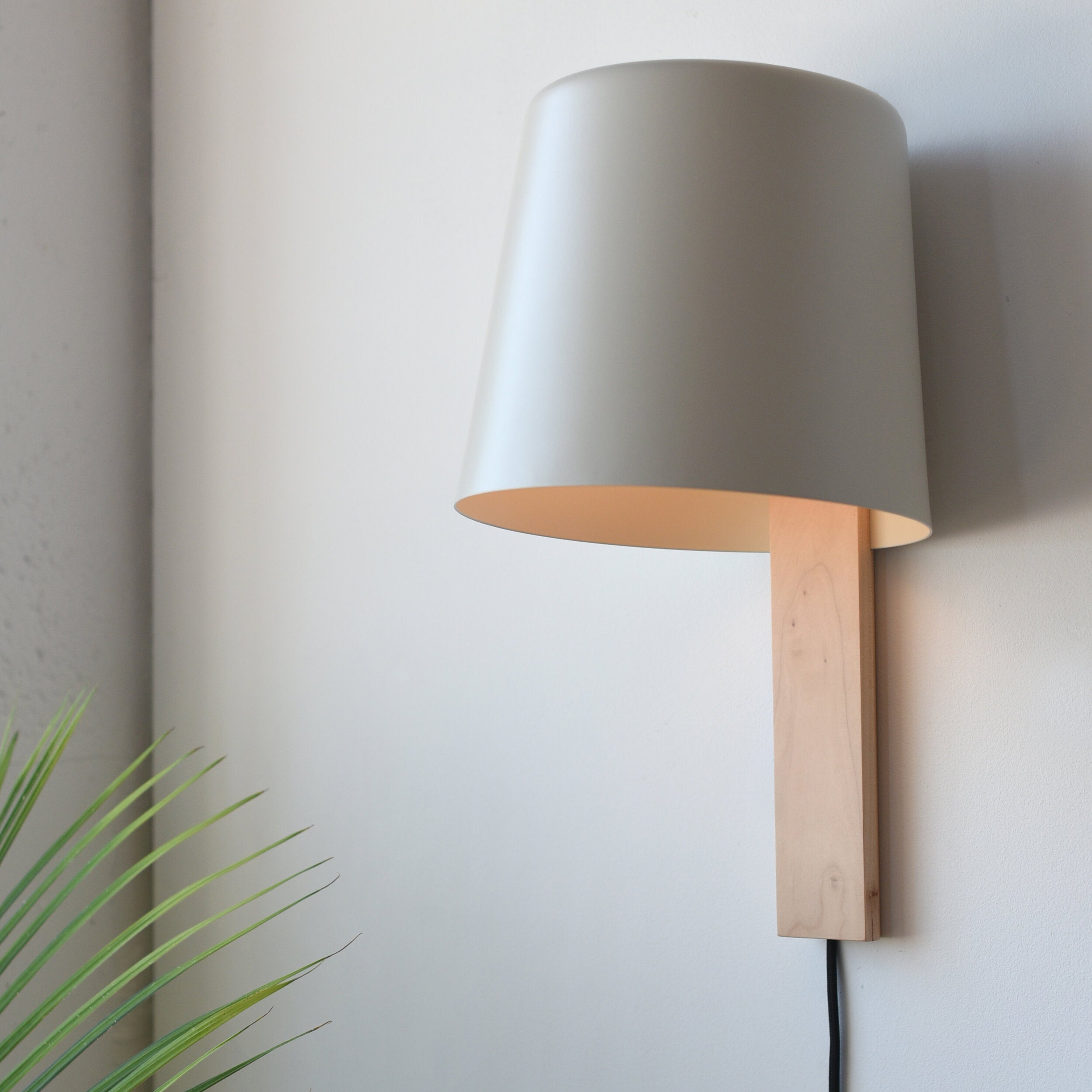 Pilot Sconce mounted beside an entryway mirror