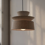 cotton pendant lamp hanging over a dining table