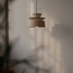 three nested cotton layers of a handmade pendant lamp