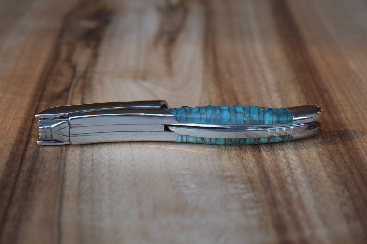 Folded corkscrew seen from the side on wood