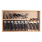 Complete 24-piece French flatware set arranged in branded presentation box, top view